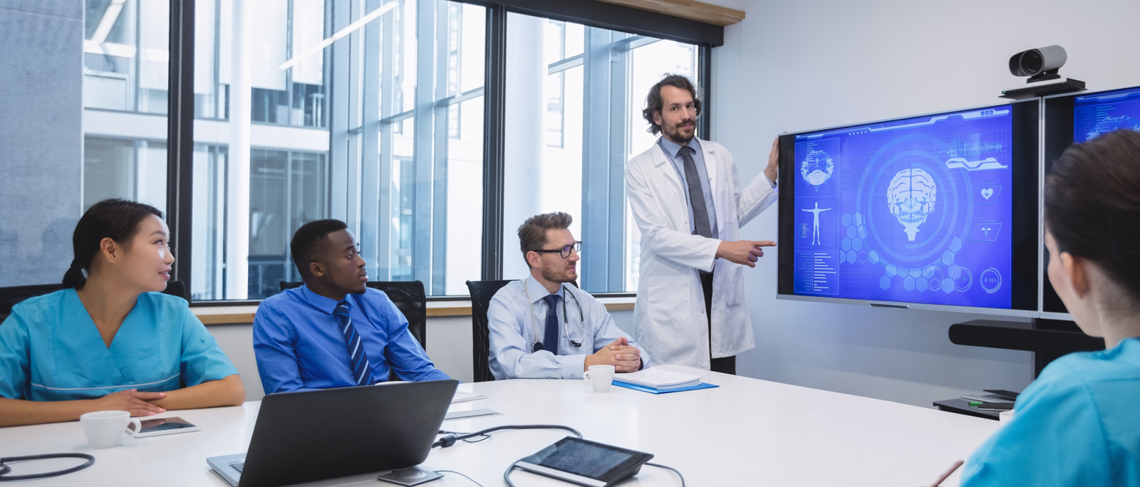 Medical team examining digital records